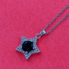 Silver Necklace with a Star Designed Pendant, Black Stone Center, and Silver Chain
