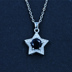 Silver Necklace with a Star Designed Pendant, Black Stone Center, and Silver Chain